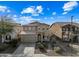 Two-story house with a tan exterior and a two-car garage at 3743 W Wayne Ln, Anthem, AZ 85086