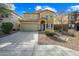 Two-story house with tan exterior, shutters, landscaping, and a two-car garage at 3743 W Wayne Ln, Anthem, AZ 85086