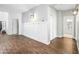 Bright foyer with wood flooring and built-in bench at 3743 W Wayne Ln, Anthem, AZ 85086