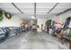 Two-car garage with extra storage space and a treadmill at 3743 W Wayne Ln, Anthem, AZ 85086