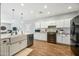 Modern kitchen with white cabinets, farmhouse sink, and stainless steel appliances at 3743 W Wayne Ln, Anthem, AZ 85086