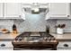 Gas range and patterned backsplash in a modern kitchen at 3743 W Wayne Ln, Anthem, AZ 85086