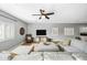 Spacious living room featuring a large sectional sofa and a modern entertainment center at 3743 W Wayne Ln, Anthem, AZ 85086