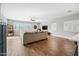 Spacious living room with hardwood floors, large sectional sofa and a ceiling fan at 3743 W Wayne Ln, Anthem, AZ 85086