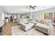 Open concept living room with a large sectional sofa and views into the kitchen at 3743 W Wayne Ln, Anthem, AZ 85086