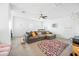 Upstairs loft with gray sectional sofa and colorful rug at 3743 W Wayne Ln, Anthem, AZ 85086