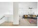 Spacious loft area with gray sectional sofa and colorful rug at 3743 W Wayne Ln, Anthem, AZ 85086