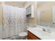 Clean bathroom with shower/tub combo, vanity, and linen cabinet at 40758 N Boone Ln, Anthem, AZ 85086