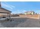Backyard with gravel, a covered patio, and a partial house view at 4122 S 185Th Ln, Goodyear, AZ 85338