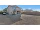 Large backyard with gravel and a view of the house at 4122 S 185Th Ln, Goodyear, AZ 85338