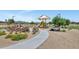Community playground with shaded seating and play structures at 4122 S 185Th Ln, Goodyear, AZ 85338