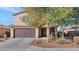 Two-story house with dark brown garage door and landscaping at 4122 S 185Th Ln, Goodyear, AZ 85338