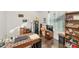 Home office with wood desk, laptop, and built-in shelving at 4122 S 185Th Ln, Goodyear, AZ 85338