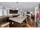 Open concept kitchen with large island and granite countertops at 4122 S 185Th Ln, Goodyear, AZ 85338