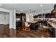 Modern kitchen with dark wood cabinets, granite counters, and island at 4122 S 185Th Ln, Goodyear, AZ 85338