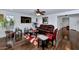 Spacious living room with hardwood floors, a leather couch, and large TV at 4122 S 185Th Ln, Goodyear, AZ 85338