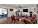 Living room features hardwood floors, red chair, and sliding door access at 4122 S 185Th Ln, Goodyear, AZ 85338