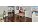 Spacious loft area with hardwood floors, red armchairs, and views into a bedroom at 4122 S 185Th Ln, Goodyear, AZ 85338