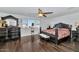 Large main bedroom with dark wood furniture and hardwood floors at 4122 S 185Th Ln, Goodyear, AZ 85338