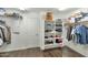 Large walk-in closet with shelving and hanging rods at 4122 S 185Th Ln, Goodyear, AZ 85338