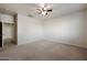 Bright bedroom with ceiling fan and plush carpeting at 41240 W Capistrano Dr, Maricopa, AZ 85138