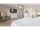 Main bedroom with dresser, TV, and large windows at 417 E Melanie St, San Tan Valley, AZ 85140