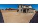 Spacious backyard with gravel and a two-story house at 4334 N Pioneer Dr, Litchfield Park, AZ 85340