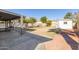 Spacious backyard with covered patio, shed, and grassy area at 4638 E Encanto St, Mesa, AZ 85205