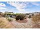 Landscaped backyard with fire pit and seating area at 4892 N 205Th Dr, Buckeye, AZ 85396