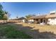 Spacious backyard featuring a patio and solar panels at 6433 W Cortez St, Glendale, AZ 85304