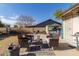 Backyard patio with wicker furniture and small table at 6433 W Cortez St, Glendale, AZ 85304