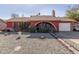 Red brick ranch house with a landscaped front yard and a two-car garage at 6433 W Cortez St, Glendale, AZ 85304