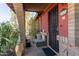 Cozy front porch with wicker furniture and desert landscaping at 6433 W Cortez St, Glendale, AZ 85304