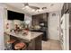 L-shaped kitchen with dark wood cabinets and island at 6433 W Cortez St, Glendale, AZ 85304