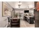 Kitchen features an island with seating and dark brown cabinets at 6433 W Cortez St, Glendale, AZ 85304
