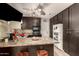 View of kitchen with dark cabinets and appliances at 6433 W Cortez St, Glendale, AZ 85304