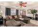 L-shaped sectional sofa dominates this living room with a large TV at 6433 W Cortez St, Glendale, AZ 85304
