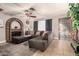 Spacious living room with sectional sofa and brick fireplace at 6433 W Cortez St, Glendale, AZ 85304