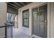 Gray front door with wreath, inviting entry to condo at 8020 E Thomas Rd # 215, Scottsdale, AZ 85251