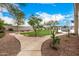 Landscaped backyard with a putting green and pathway at 9655 N 130Th St, Scottsdale, AZ 85259