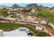 Landscaped backyard with outdoor kitchen and mountain views at 9655 N 130Th St, Scottsdale, AZ 85259
