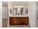 Modern bathroom with double vanity and stylish wood cabinets at 9655 N 130Th St, Scottsdale, AZ 85259