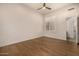 Bright bedroom featuring wood floors and a window with shutters at 9655 N 130Th St, Scottsdale, AZ 85259