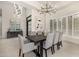 Modern dining room with a large table and chandelier at 9655 N 130Th St, Scottsdale, AZ 85259