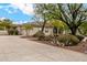 Single story home with manicured landscaping and long driveway at 9655 N 130Th St, Scottsdale, AZ 85259