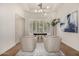 Bright home office features wood floors, two armchairs, and a window seat at 9655 N 130Th St, Scottsdale, AZ 85259