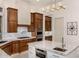 Modern kitchen featuring double ovens, gas cooktop, and custom cabinetry at 9655 N 130Th St, Scottsdale, AZ 85259