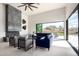 Inviting living room showcases a sleek fireplace, comfortable seating, and seamless access to the outdoor patio at 9655 N 130Th St, Scottsdale, AZ 85259