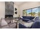 Spacious living room featuring a fireplace and mountain views at 9655 N 130Th St, Scottsdale, AZ 85259
