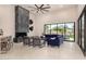 Living room with a linear fireplace, kitchen access and mountain views at 9655 N 130Th St, Scottsdale, AZ 85259